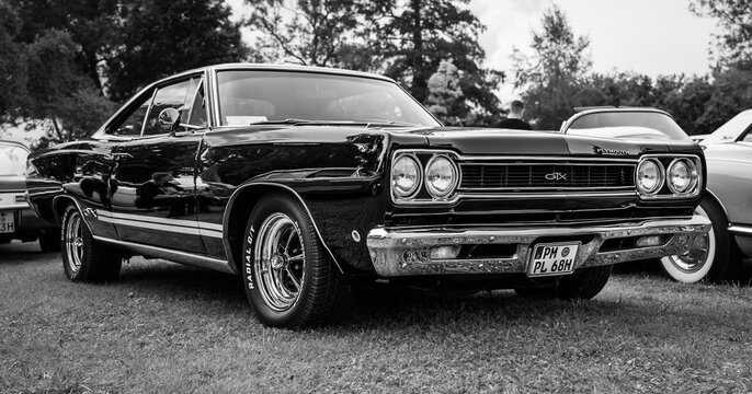 DIEDERSDORF, GERMANY - AUGUST 30, 2020: The muscle car Plymouth GTX, 1968. Black and white. The exhibition of "US Car Classics".