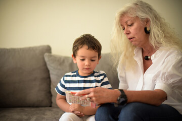 young boy and his grandmother at home