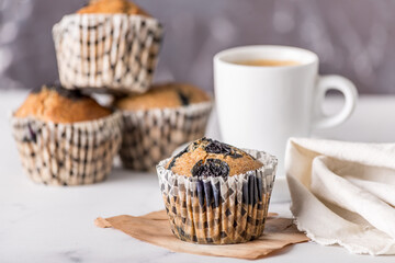 Sweet cakes or cupcakes on light marble background. Holiday cake celebration, delicious dessert, close up