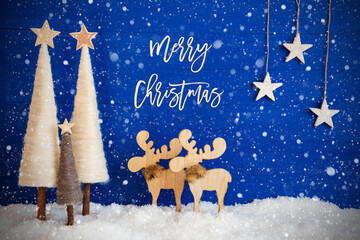 English Calligraphy Merry Christmas On Blue Background With Snow. Decoration Like Crhistmas Trees, Moose And Stars And Snowflakes.
