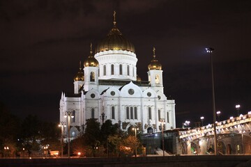 Fototapeta na wymiar Panorama of the night city with neon lights. Cathedral of Christ the Savior at night