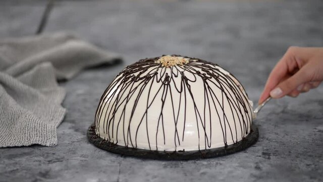 Pancho cake with pineapple and sour cream topped with chocolate and nuts.