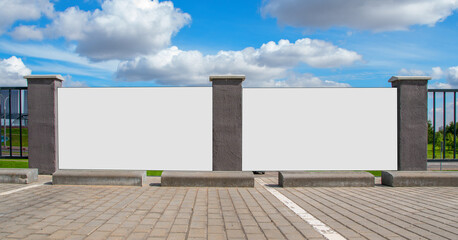 blank white banners for mockup information on fence at city street © Bonsales