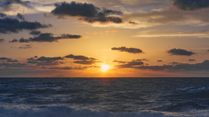 Naklejka na ściany i meble sunset over the sea with clouds