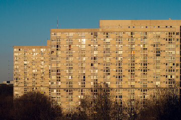 Old, big concrete block of flats over a clear blue sky in the capital of Poland - Warsaw. Europe