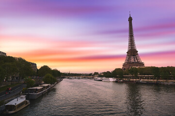 Fototapeta na wymiar Sunset over the the Eiffel Tower and the Seine River in Paris, France.