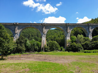 Fototapeta premium Cement train bridge outside of Brad town, Romania