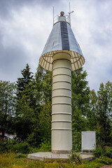 Land based cone shape maritime navigation signal light and marker guiding to safe passage through...