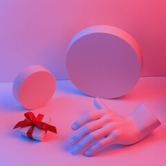 Composition with gypsum hand. A box with a red ribbon on the podium. Gift concept