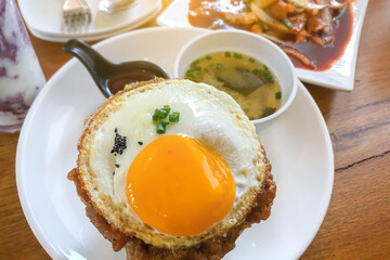 Kimchi fried rice with fried egg and pork. Korean food style.