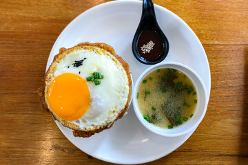 Kimchi fried rice with fried egg and pork. Korean food style.