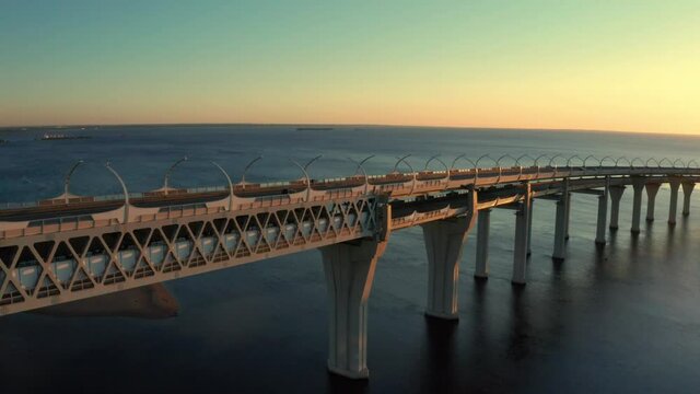 High-speed toll road, highway bypassing the city center St. Petersburg, the central section of the western high-speed section. A beautiful view of the sunset over the Gulf of Finland.