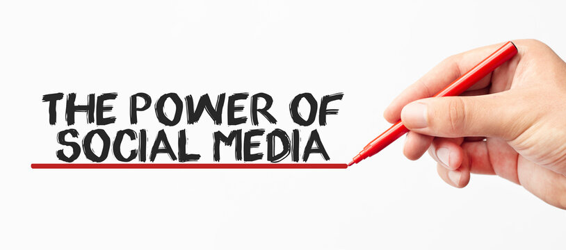 Hand writing THE POWER OF SOCIAL MEDIA with red marker. Isolated on white background. Business, technology, internet concept. Stock Image