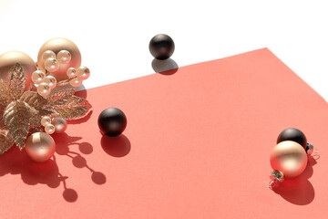 Christmas arrangement isolated on white with copy-space. Black Xmas trinkets and golden twig with...