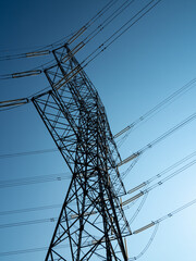 high tension metal towers in the mountain area