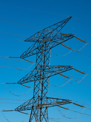high tension metal towers in the mountain area