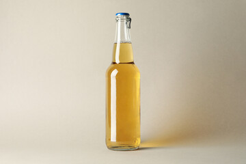 Bottle of beer on gray background, space for text