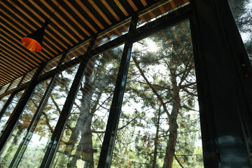 Window and stylish wooden ceiling in restaurant