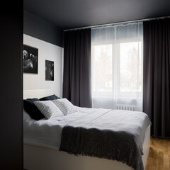 Small bedroom with black ceiling