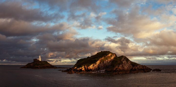 Offshore island with lighthouse on Mumbles Head in Swansea Bay