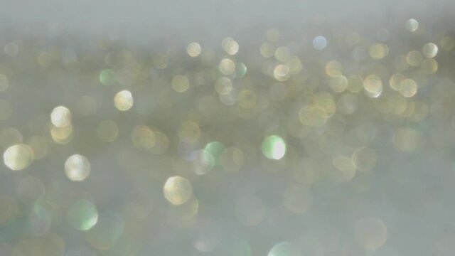 Particles gold bokeh glitter awards dust abstract background loop