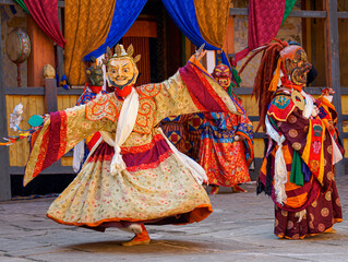 Bumthang in Bhutan at the yearly  festival in the monastery of Jakar. A monk is wearing  a colourful traditional mask.