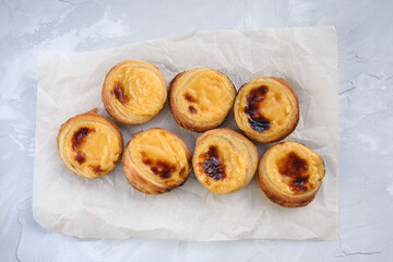 Traditional Portuguese popular dessert Pastel de nata or Pastel de Belem. Delicious puff pastry cups with custard.