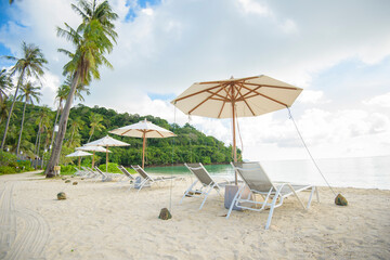 Beautiful view landscape of lounge chairs on tropical beach, the emerald sea and white sand against blue sky, Maya bay in phi phi island , Thailand