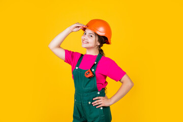 hello. Little girl using a measuring tape. construction worker with tape measure. Cute kid as a construction worker. kid repairing home. happy childhood. self-retracting metal tape measure