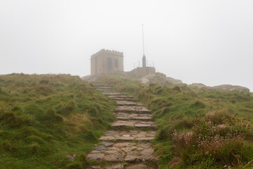Watch tower in thick fog