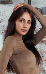 Portrait of young brunette girl with healthy shiny hair