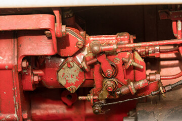 Old red tractor engine of a Same tractor