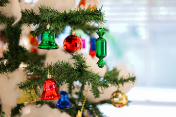 christmas decoration with toffee gift bells balls boxes boots stars with christmas tree and cotton with blurred background