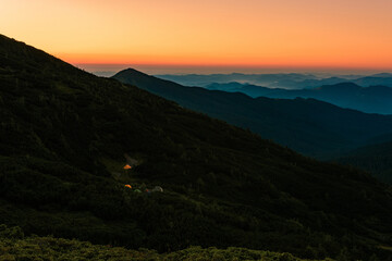 Picturesque landscapes of the Carpathians, before sunrise there is a light fog, sunrise in Montenegro.