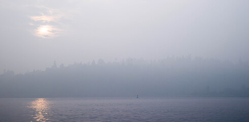 Smoke filled air over water in the Puget Sound, Washington