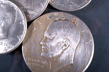 one dollar coin and fifty cent coin
