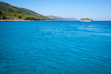 Obraz premium Abandoned boat floating on the sea, beautiful dark blue sea, paradise on the planet, croatia, zivogosce