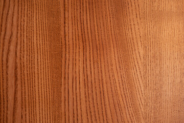 The structure of natural ash wood, tinted oak. Hardwood. Creative vintage background. Imitation of aging.