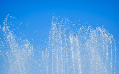 artesian fountain on blue sky
