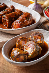 .Roll steak in delicious tomato sauce.