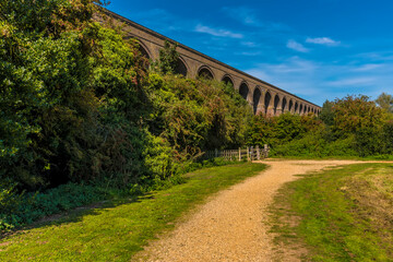 Fototapeta premium A view along the side of the western end of the Chappel Viaduct near Colchester, UK in the summertime