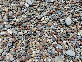 Colorful water-worn pebbles cover the beach along the Sonoma Coast, California 