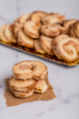 Palmiers cookies on white marble
