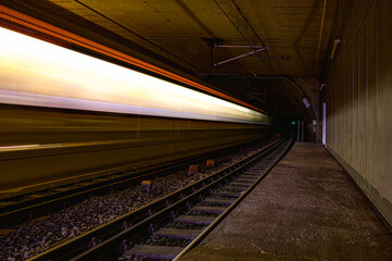 Speed lights of train on railway in tunnel