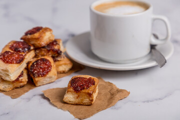quince cookies on marble board with coffee