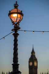 Fototapeta na wymiar Lamppost with an out of focus Big Ben in the background.