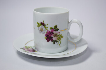 Ceramic coffee cup with drawn flowers