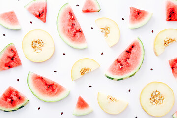 Sliced watermelon and melon pattern on white background. Top view