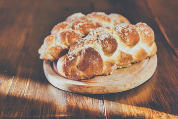 Challah bread on wooden table