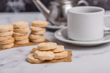 fat cookies with tea on marble